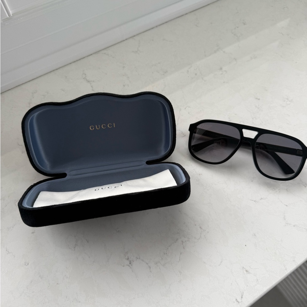 Gucci Dark Sunglasses with Elegant Case